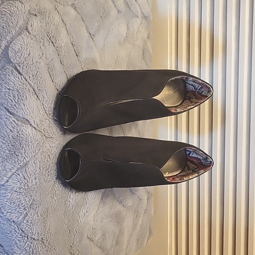 Black suede peep toe high heels.